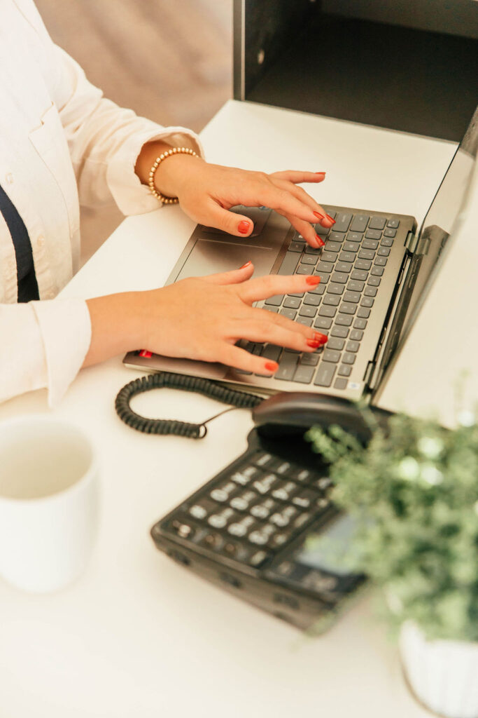 A Woman On a Laptop Performing Tenant Screening in California