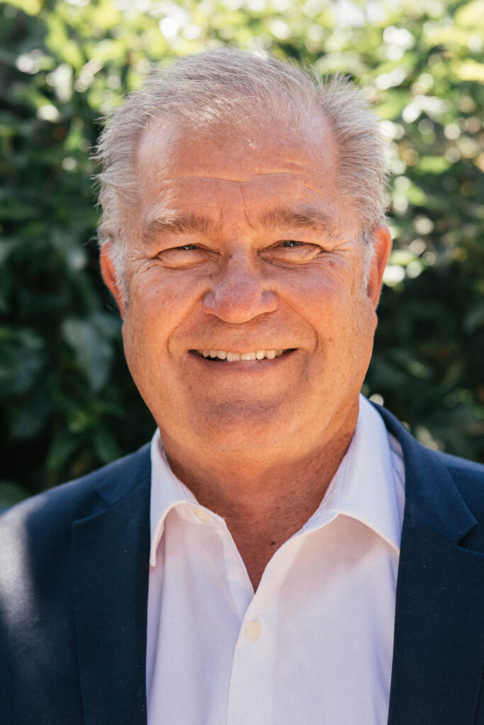 Smiling man in suit outdoors
