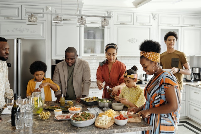 Family cooking together in a modern kitchen.