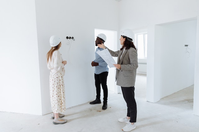 Architects inspecting unfinished building interior